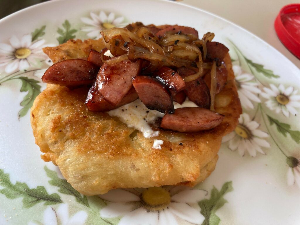 image of kielbasa on hungarian fried bread.